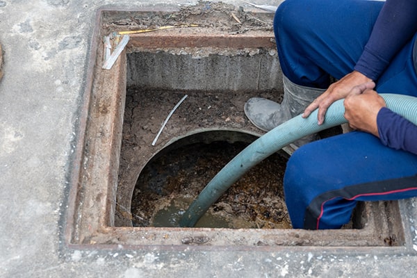 during grease trap pumping, a vacuum truck will remove the accumulated grease and waste from the trap
